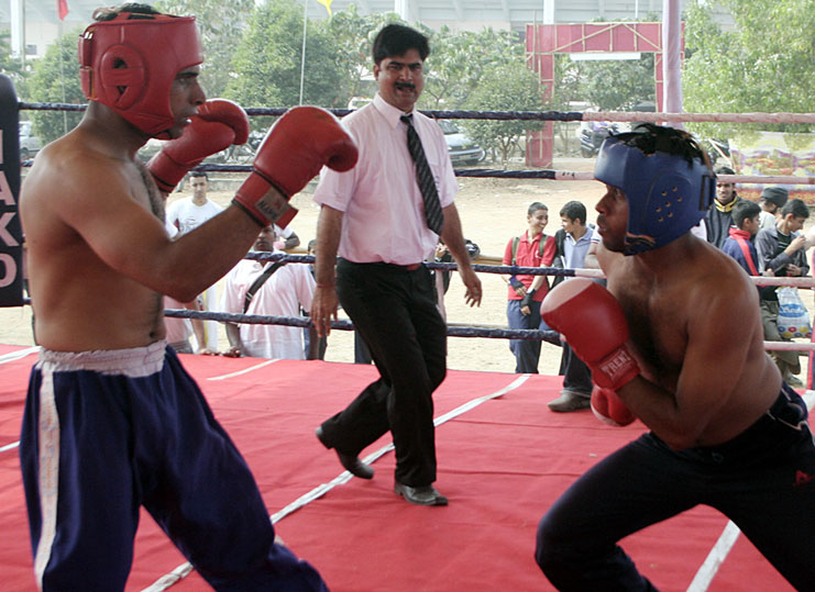 Mohammad Nakeeb (right) of Orissa and ARF`s Parveen Luxry fight for victory at the Indian Open National Kickboxing Championship in Bhubaneswar on Dec 19, 2008.