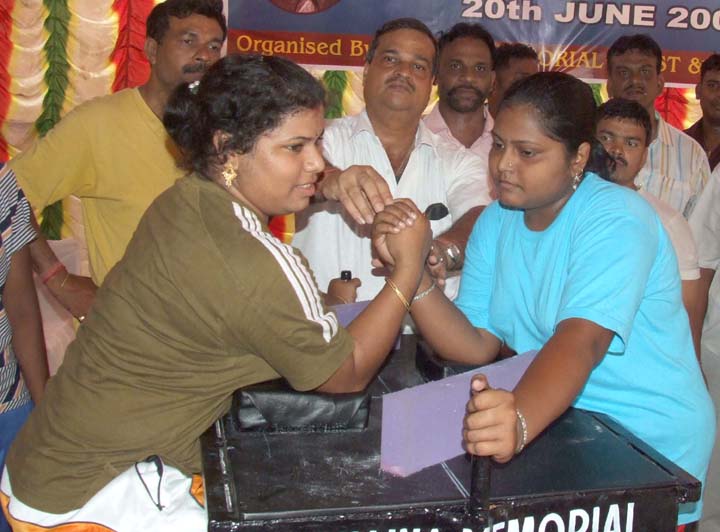 Women fight for glory in the first Bhaina Memorial All-Orissa Arm Wrestling Tournament in Bhubaneswar on <b>June 20, 2009.